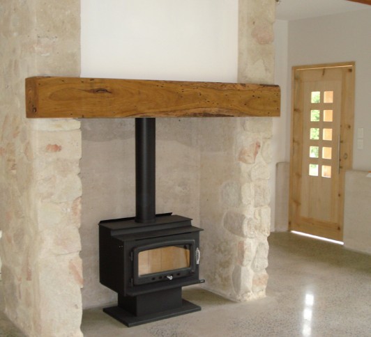 rammed earth and stone fireplace