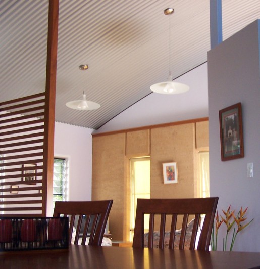 Rammed earth wall, curved ritek ceiling